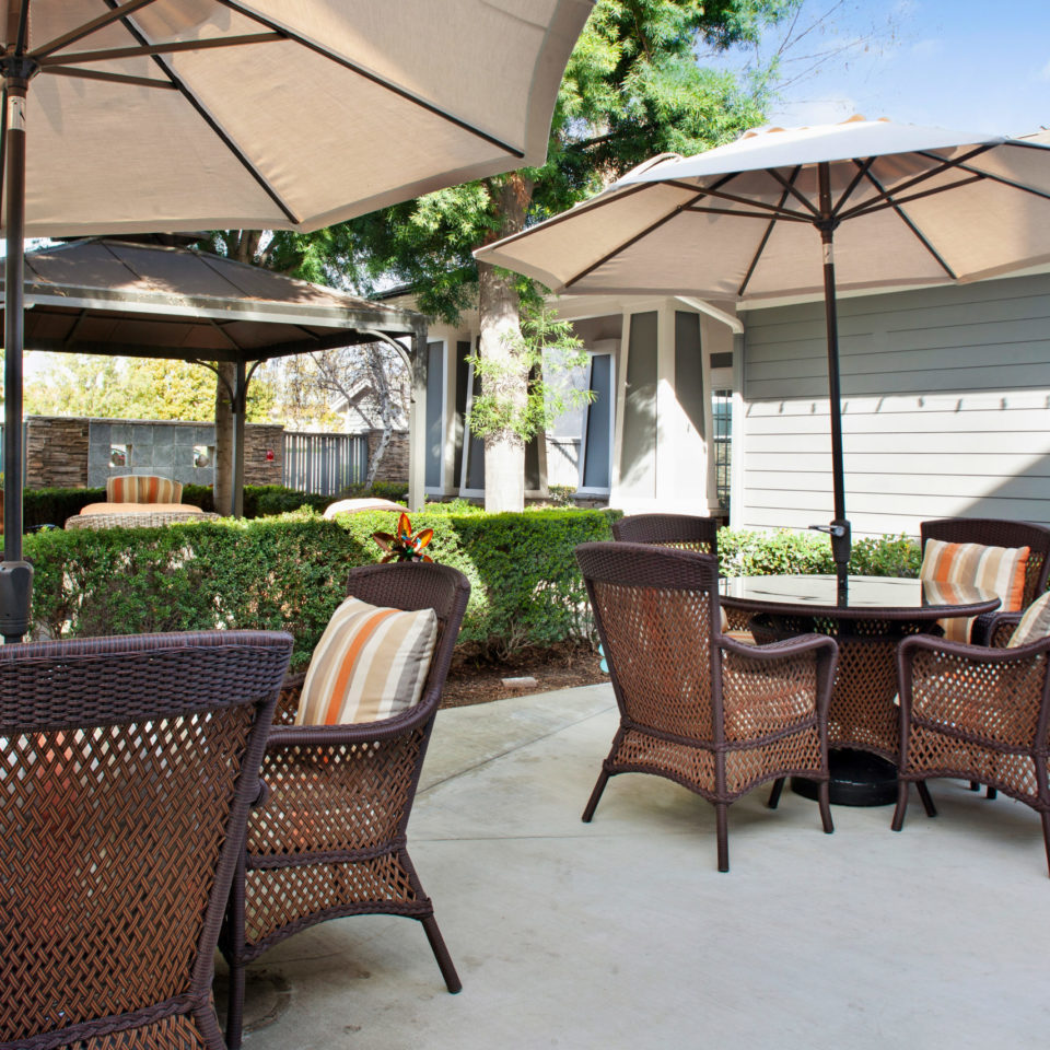 Brandford patio with tables chairs and umbrellas
