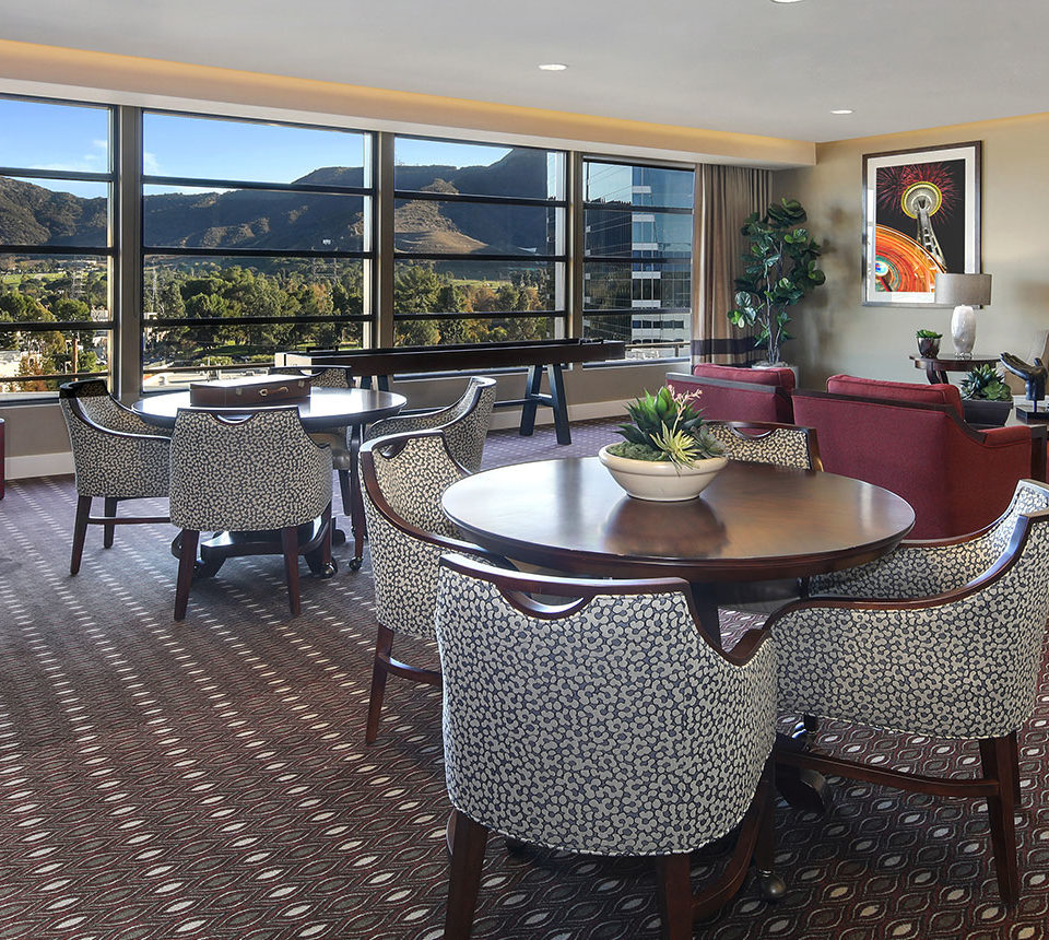 Burbank lounge with seating areas and view of mountains