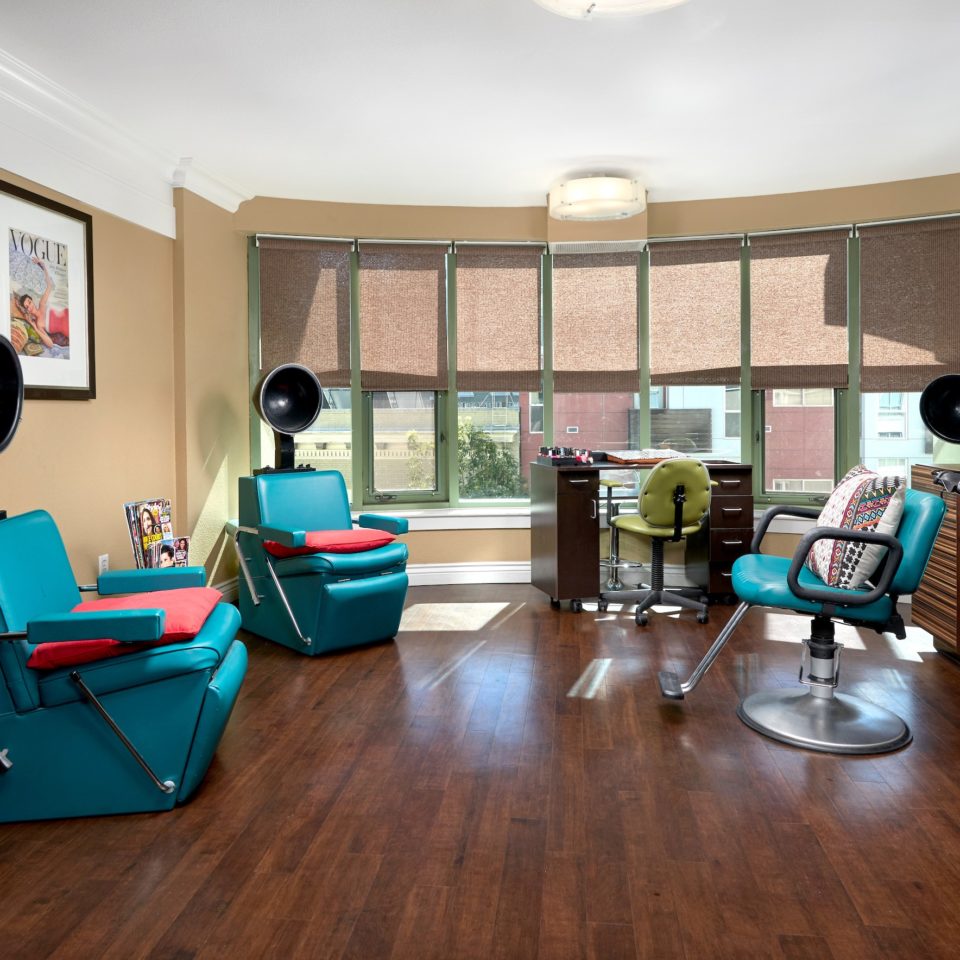 Cathedral Hill salon has light blue comfortable chairs and lots of sunlight.