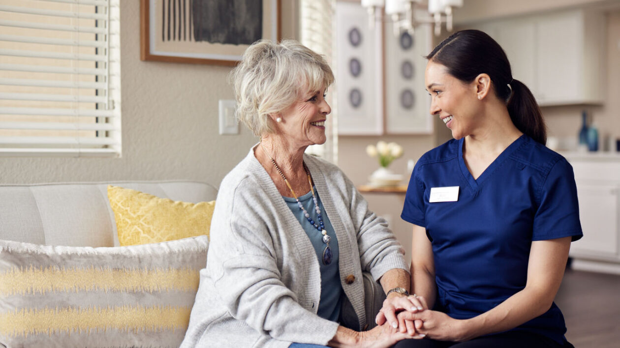 elderly woman discussing with a nurse