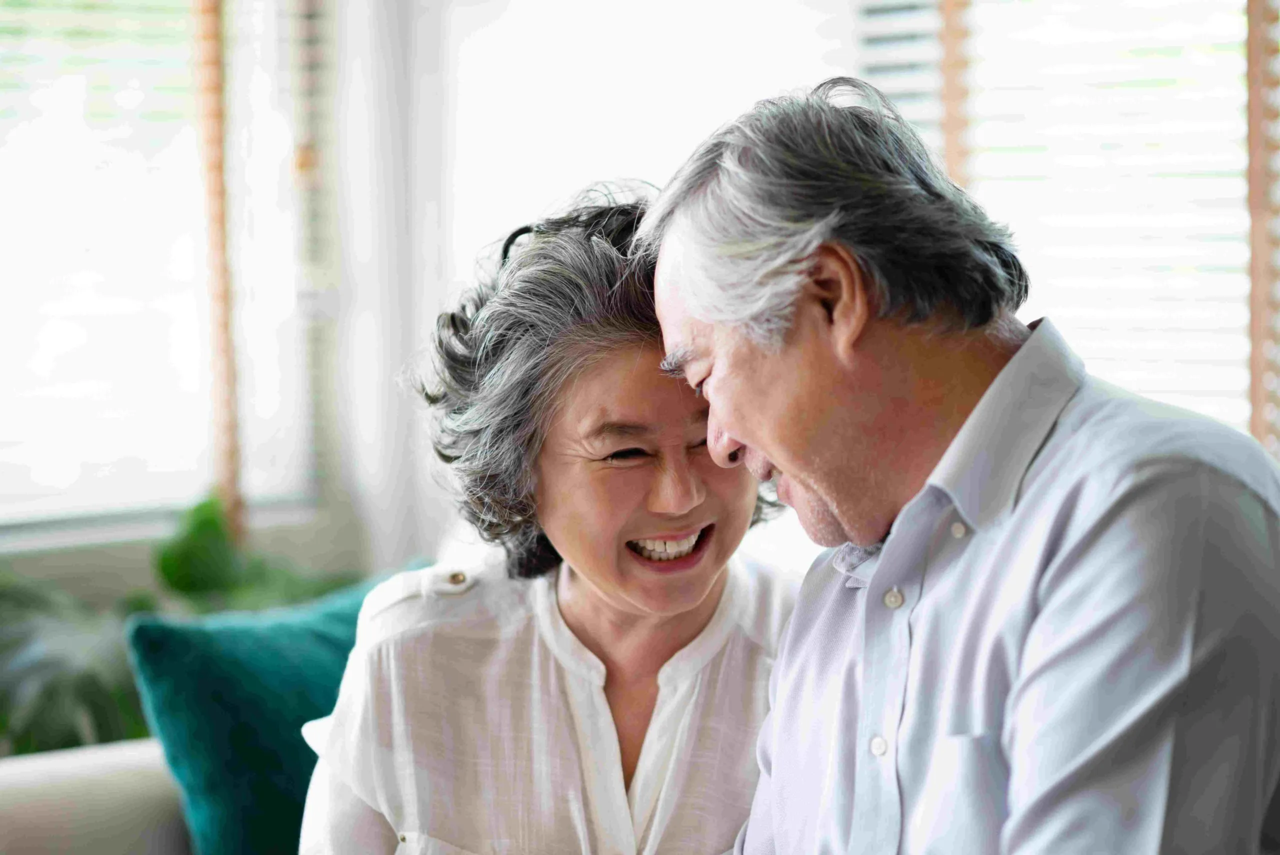 Senior couple smiling together.