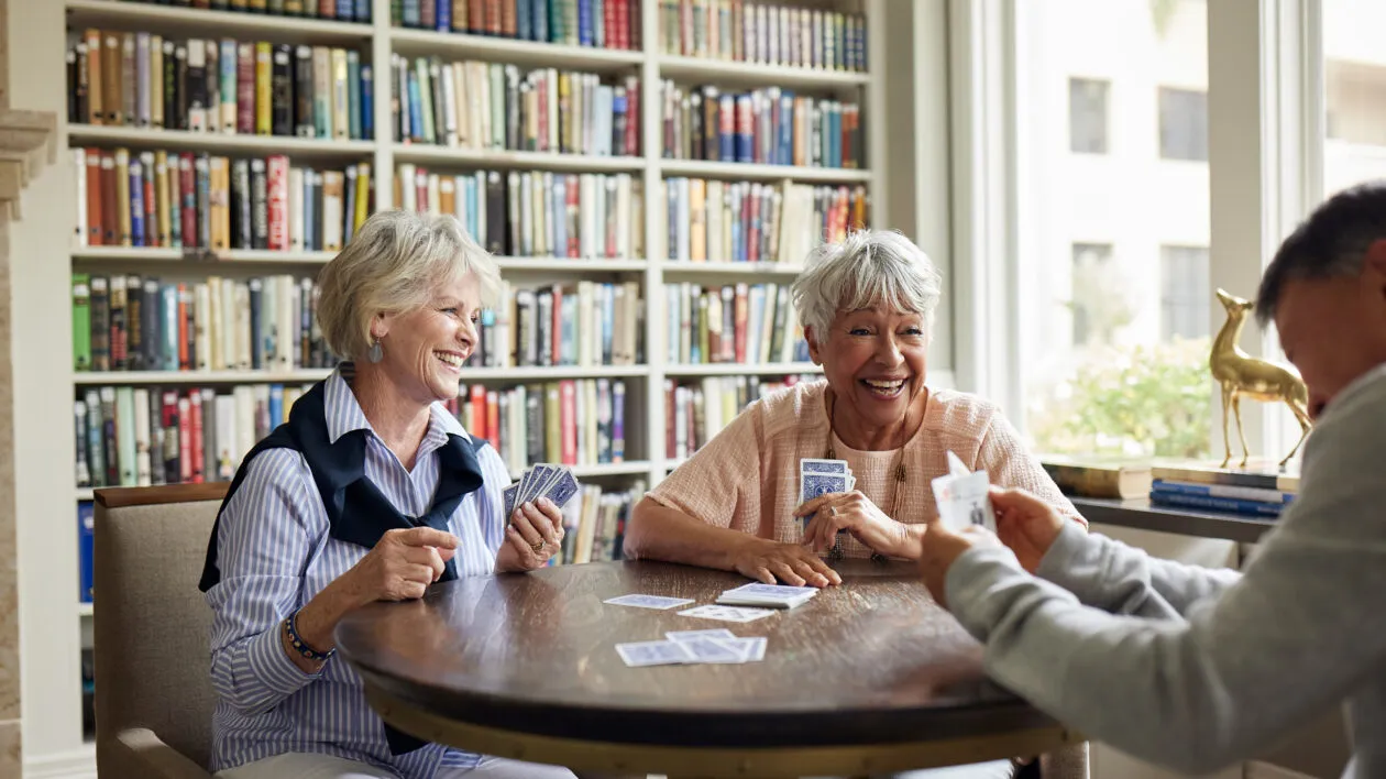 Senior residents enjoying spending time together at a table.