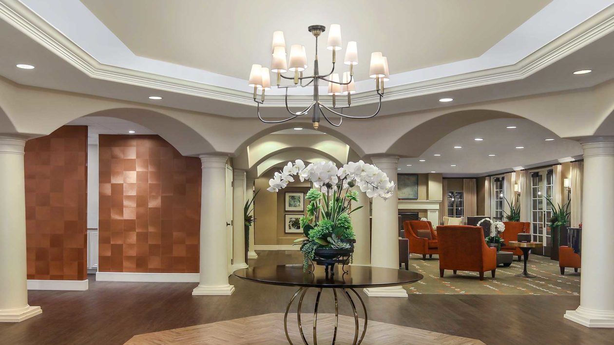 Mission Viejo main lobby with table, flowers and chandelier