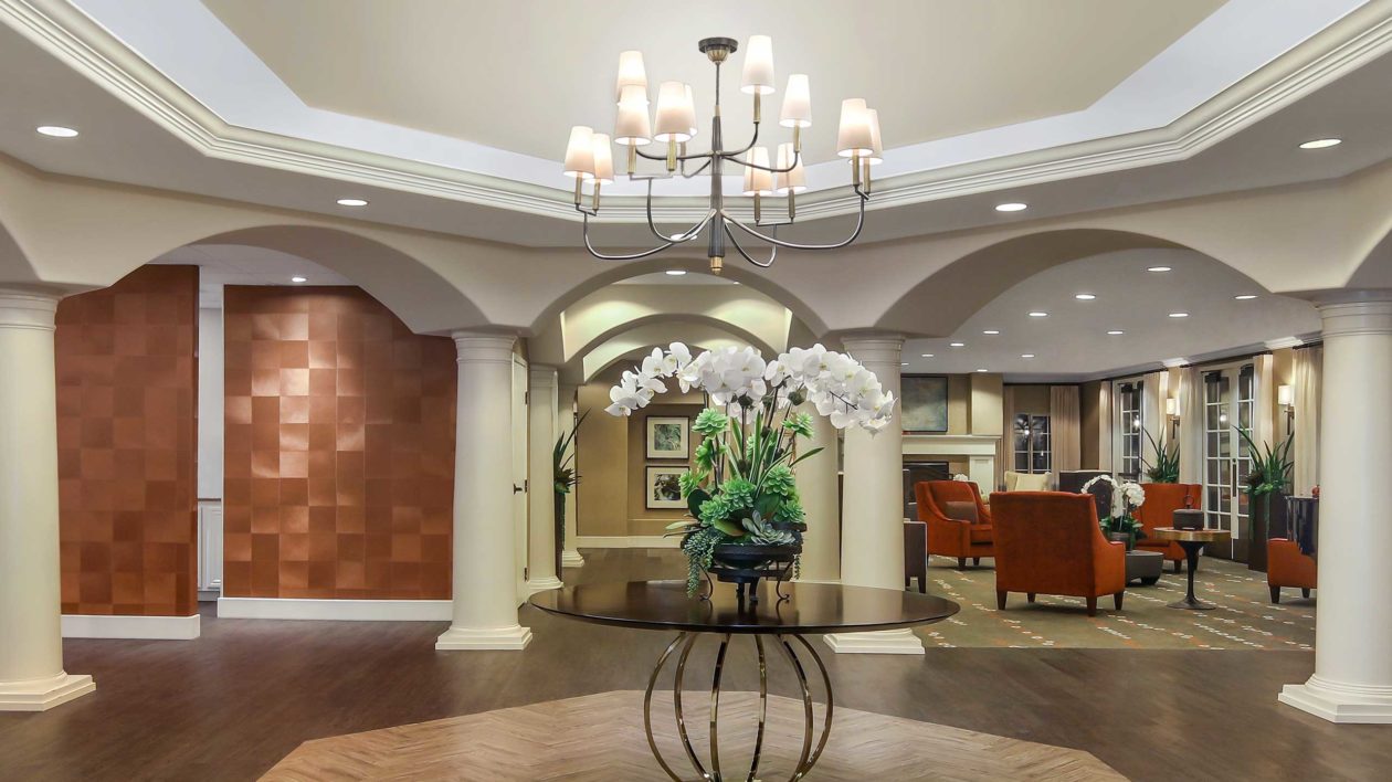 Mission Viejo main lobby with table, flowers and chandelier