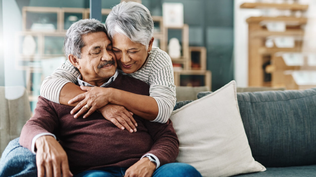 A cheerful woman hugging her husband.
