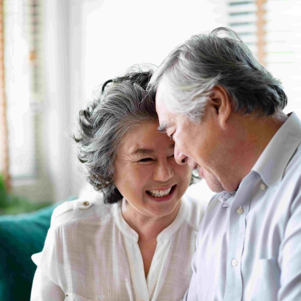 Senior couple smiling together.