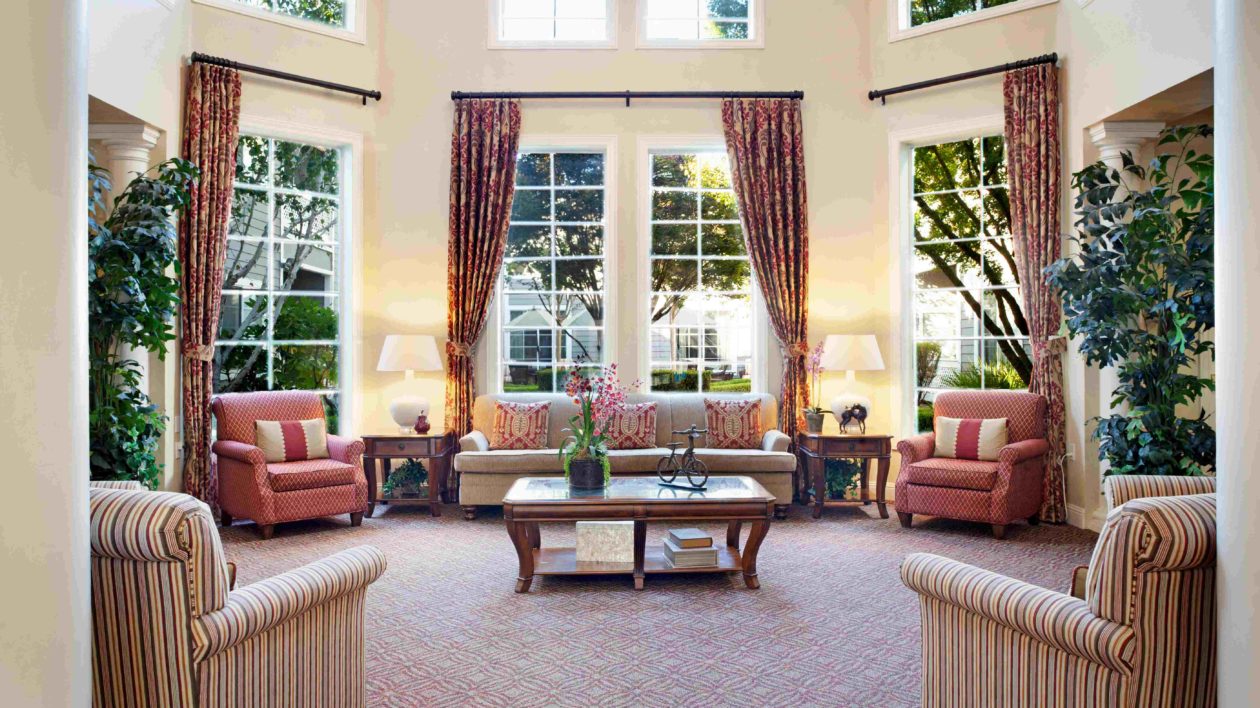 San Ramon sitting room, with large windows, couches and chairs.