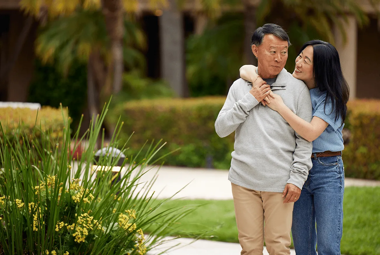 family hugging in park