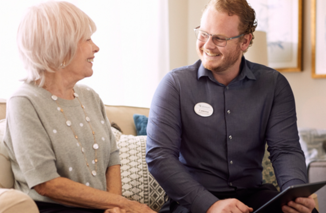 An Ivy Living team member socialising with a resident.
