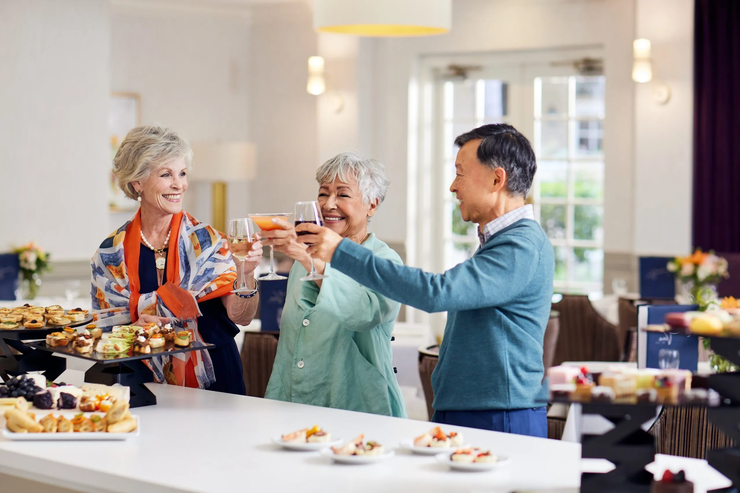 Residents enjoying a drink, toasting to their friendship.