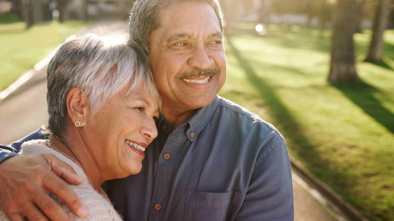 Shot of a happy couple relaxing outdoors.