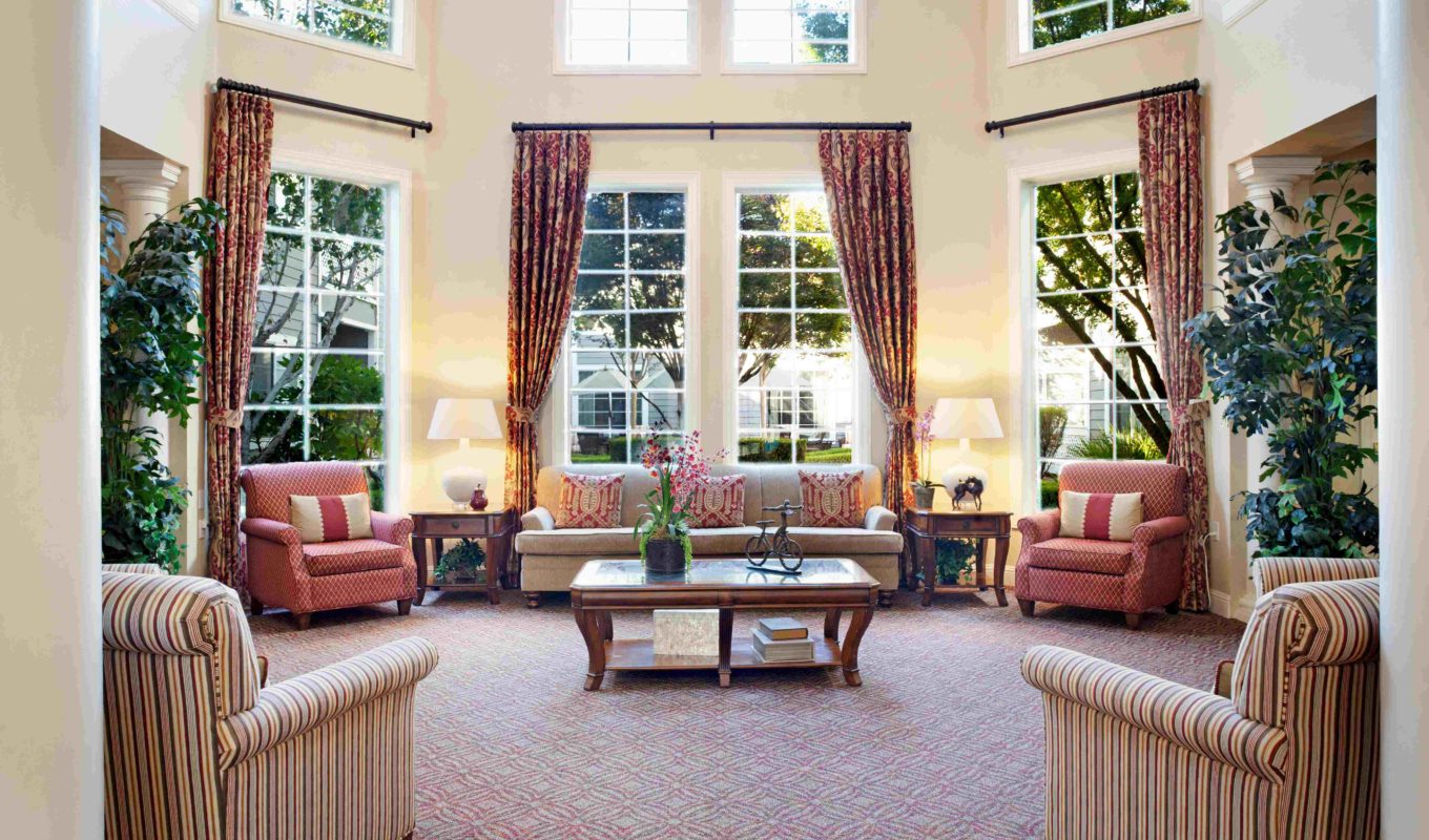San Ramon sitting room, with large windows, couches and chairs.
