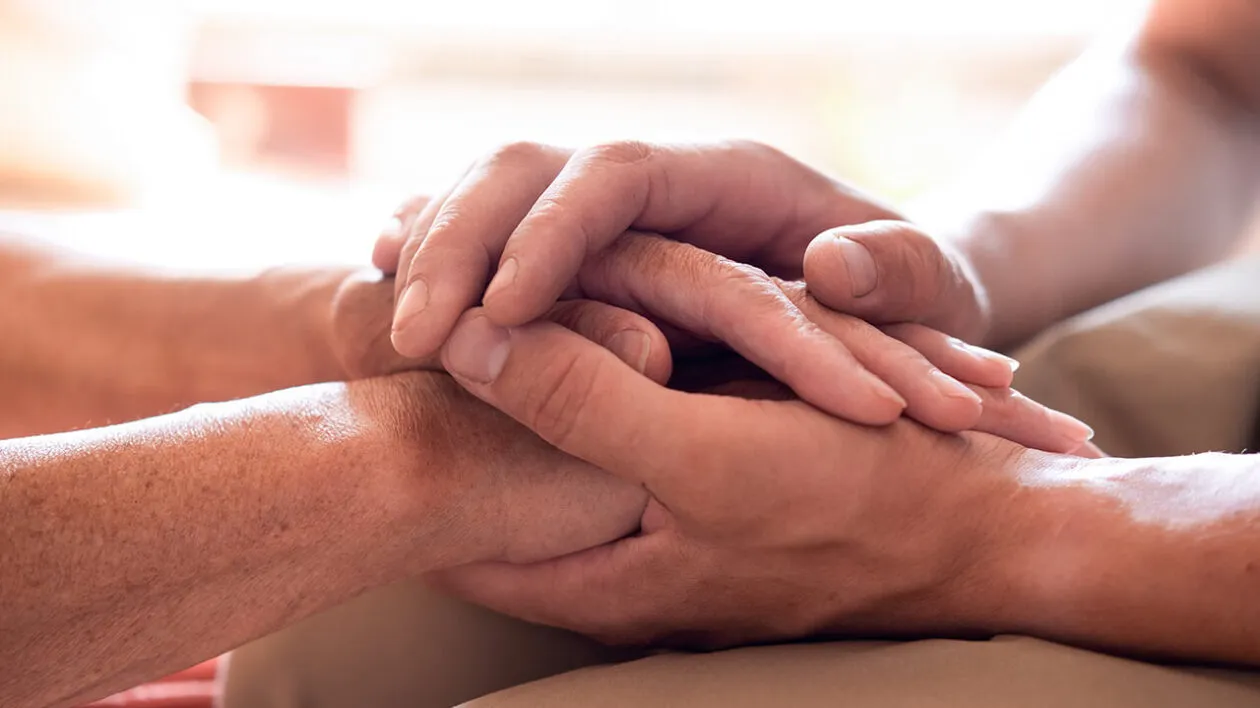 young-person-hands-holding-senior-hands