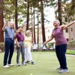 group-of-seniors-laughing-playing-golf-together
