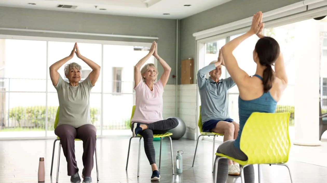 group-of-seniors-having-yoga-class-with-a-lady-trainer