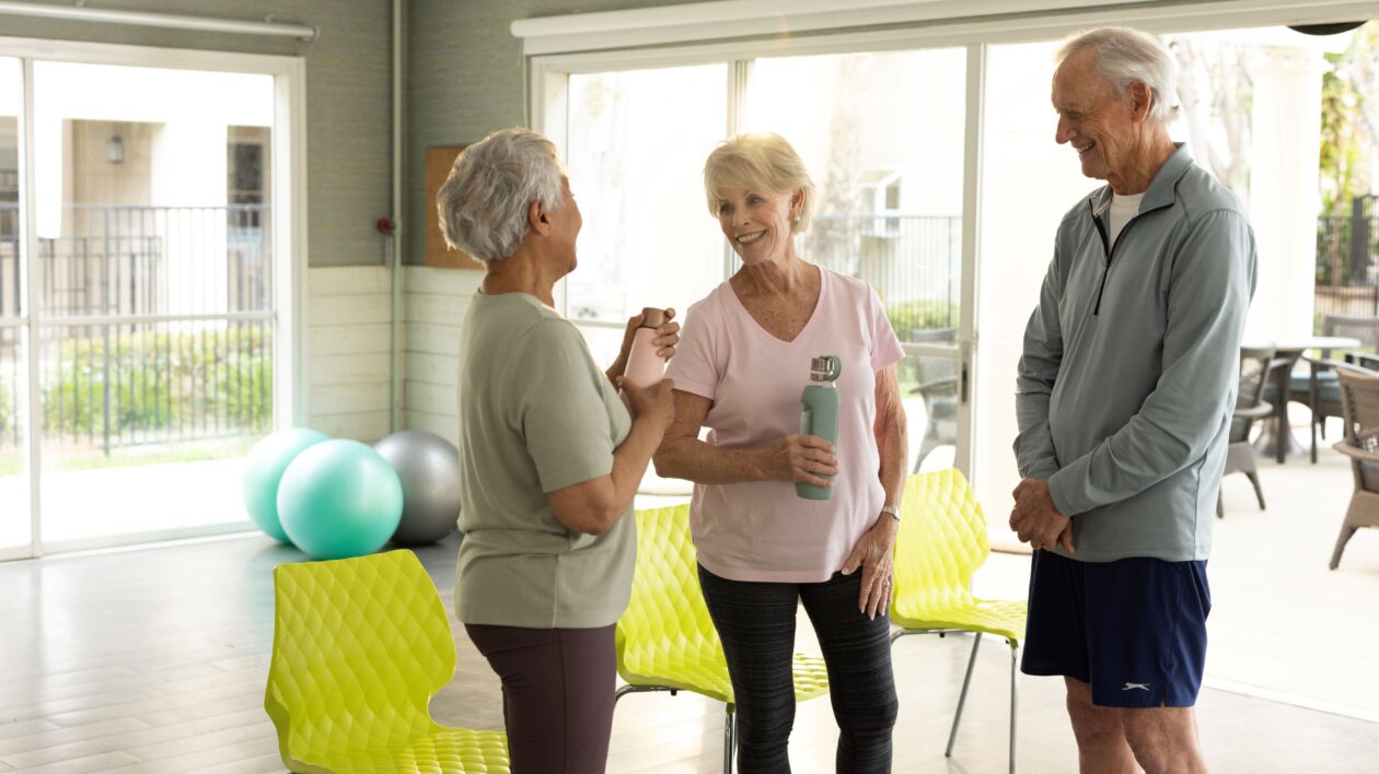 group-of-3-seniors-talking-during-sport-class