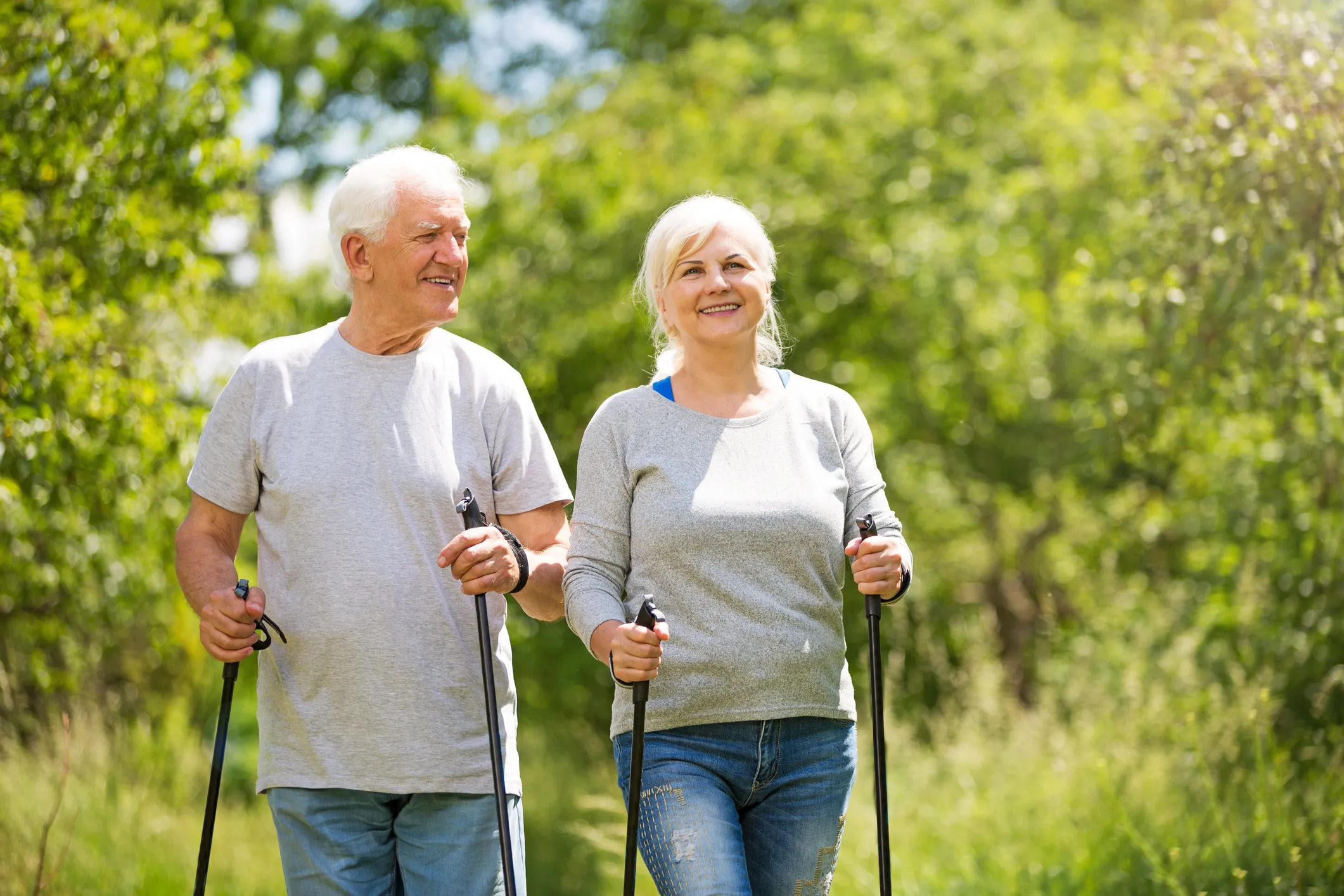 senior-couple-walking-together-in-a-park