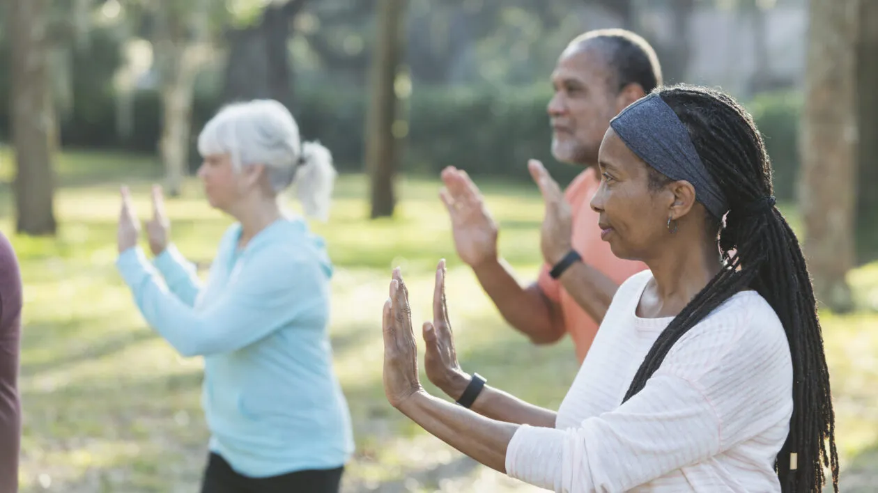 seniors-in-a-park-excercising-with-tai-chi-class