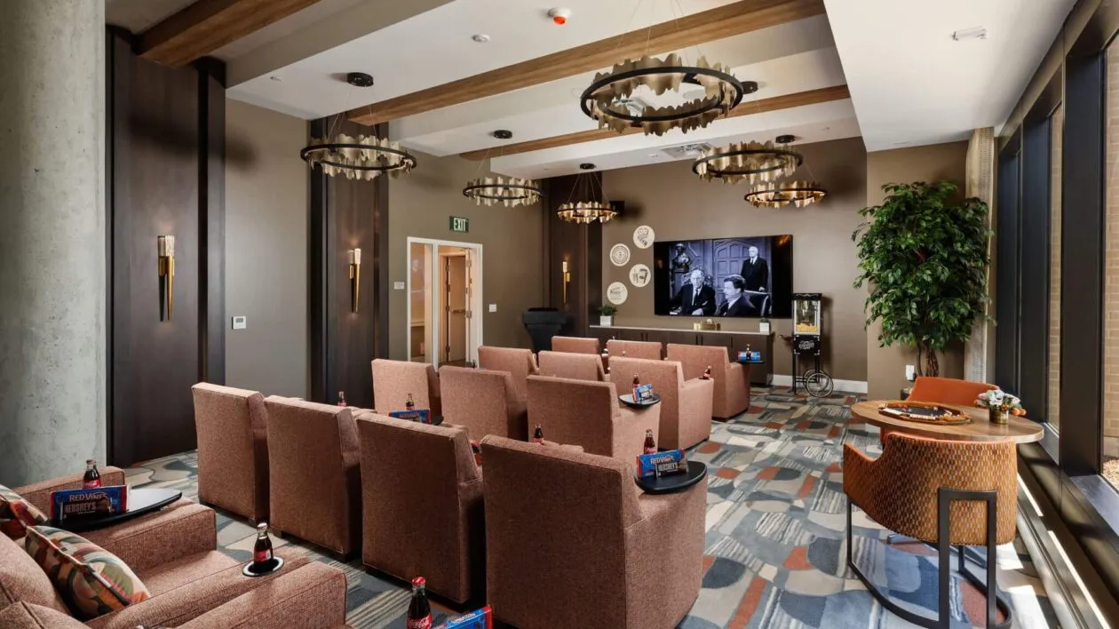 Luxury senior living movie theater room at The Ivy Berkeley with comfortable seating for residents.